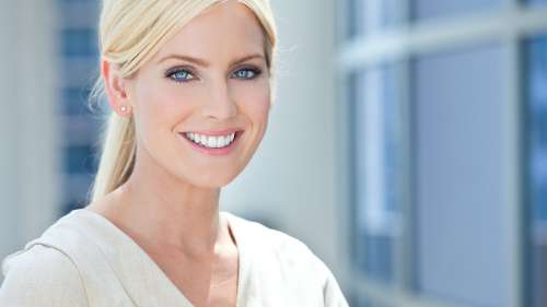 Blonde women with blue eyes smiling, fishers in